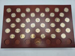 lot 24 image: 507 Presidential Dollars--39 in Wood Display Capsules and 39 Rolls of 12 Each--Uncirculated