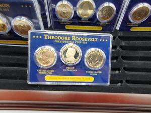 lot 25 image: 51 Presidential Dollars in Wood Display Case--Uncirculated