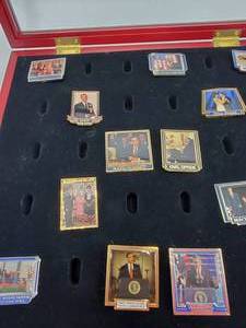 lot 42 image: 13 Obama Collector Pins in Wood Case