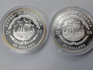 lot 46 image: (2) 2000 Liberia $20 .999 Silver Coins, 20 grams each in capsules