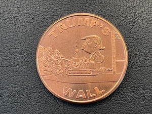lot 39 image: 1 Ounce .999 Fine Copper Round Trumps Wall