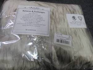 lot 81 image: EVAZEN Sleeveless Faux Fur Shawl Re...