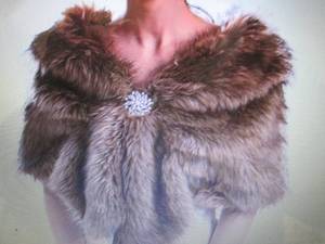 lot 86 image: EVAZEN Sleeveless Faux Fur Shawl Re...