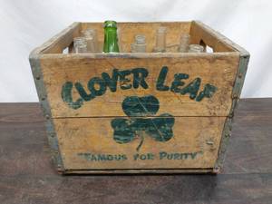 lot 7 image: Clover Leaf Wooden Box with Glass Bottles