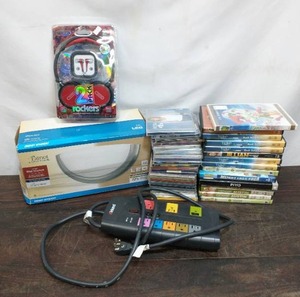 lot 19 image: Collection of CDs, DVDs, Headphones, Surge Guard, and Wall Sconce