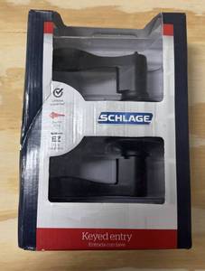 lot 38 image: Pair of Schlage Locks - Keyed Entry & Hall and Closet (Black). Appear new in box.