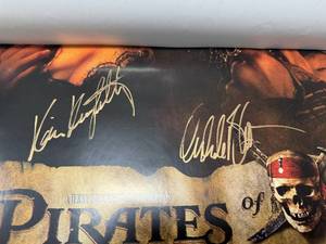 lot 102 image: Autographed and Authenticated Pirates of the Carribean Movie Poster