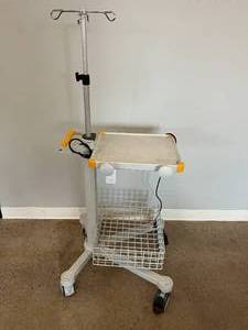 4-Ram I.V. Pole with Wire Basket, Power Outlet, and Medicine Supply Table - Great Working Condition - Table Needs Cleaning