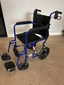 MSRP $350 FLOOR MODEL NEW Medline Blue Lightweight Aluminum Transport Transfer Collapsible Chair Larger Wheels For Better On Uneven Surfaces With Braking System 300 lbs Capacity &amp Lifetime Warranty On Frame