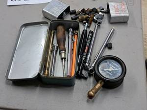 lot 692 image: Tire Gauges, Valve Caps with Metal Tin