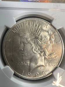 lot 10 image: 1923 US PEACE SILVER DOLLAR NGC MS63