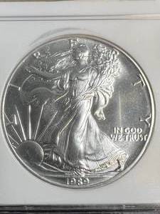 lot 28 image: 1989 AMERICAN SILVER EAGLE NGC MS69