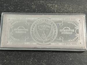 lot 81 image: 4 TROY OZ .999 FINE SILVER $1,000,000 BILL DESIGNED BAR