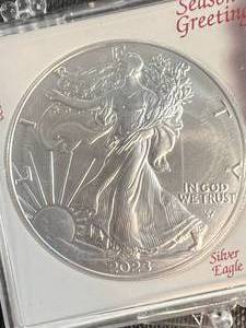 lot 13A image: 2023 AMERICAN SILVER EAGLE 1 TROY OZ .999 FINE SILVER IN SEASONS GREETINGS CASE