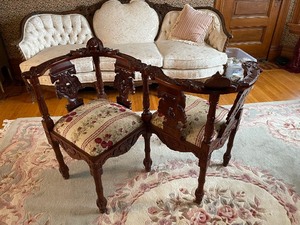 lot 211 image: Unique Carved Tete A Tete French Style CourtingKissing Chair with Carved Figure Heads