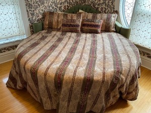 lot 247 image: Round Greet Tufted Camel Back King Size Bed