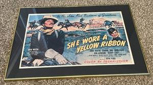 lot 192 image: John Wayne Framed 18x26 She Wore a Yellow Ribbon Movie Poster