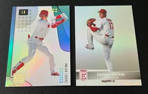 lot 128A image: Shohei Ohtani 2 Card Foil Lot - 2022 Chronicles Elite #46 and 2019 Status #14 Baseball Cards