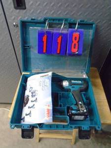 lot 118 image: Makita 12 volt impact driver with battery. No charger included. Item was a store display. As shown.