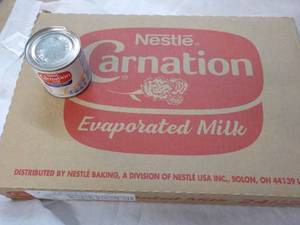 lot 117 image: 24 ct 5 oz Cans Nestles Carnation Evaporated Milk - best date 08312023