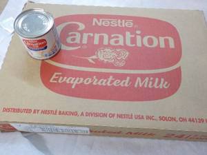 lot 118 image: 24 ct 5 oz Cans Nestles Carnation Evaporated Milk - best date 08312023