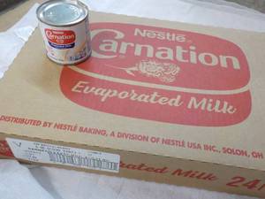 lot 119 image: 24 ct 5 oz Cans Nestles Carnation Evaporated Milk - best date 08312023