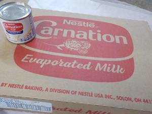 lot 120 image: 24 ct 5 oz Cans Nestles Carnation Evaporated Milk - best date 08312023