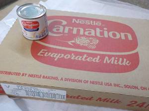 lot 121 image: 24 ct 5 oz Cans Nestles Carnation Evaporated Milk - best date 08312023