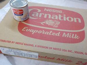 lot 123 image: 24 ct 5 oz Cans Nestles Carnation Evaporated Milk - best date 08312023