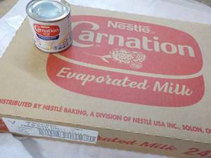 lot 124 image: 24 ct 5 oz Cans Nestles Carnation Evaporated Milk - best date 08312023