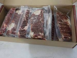 lot 322 image: L Beef Ribeye Frozen Lip-On Steak 10.50 lb. box