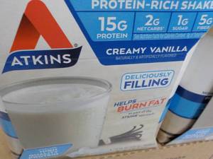 lot 408 image: 12 x 11 oz Atkins Creamy Vanilla Shakes best date 111123