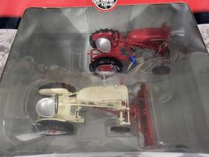 lot 10 image: Farmall Cub with 153 Disk Plow & Farmall Cub Demonstrator with leveling and grader blade 116