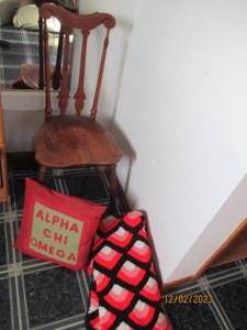 Decorative Wood Vintage chair with accent pillow and hand made afghan.