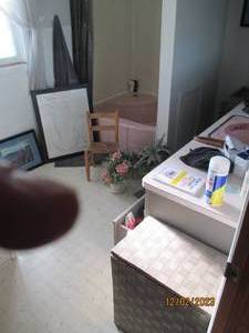 All content of main bathroom including personal care supplies, reading materials, countertop, wall and floor decor, hamper and more