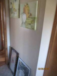 Pair of 16 fruit and vase canvas wall decor, wood framed mirror and Betsey Cameron Best Buddies wall decor