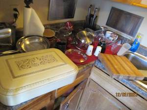 Cuisinart Cookware, Cameo Estate Silverware chest and other kitchen appliances and utensils on counter to the left of sink