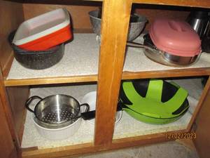 All cookware, Bakeware and supplies in lower cupboards to the right of fridge