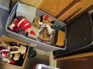 45 gallon covered tote containing a variety of vintage to modern day Christmas decor
