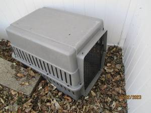 Medium sized plastic pet travel kennel