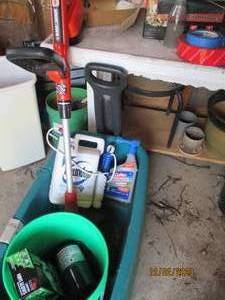 Step 2 Wagon containing misc yard tools and chemicals