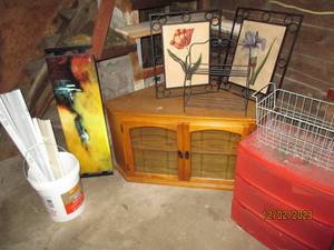 Wood and Glass corner entertainment cabinet along with extremely heavy metal framed wall decor. metal shelf and baskets plus a 3-drawer storage organizer plus mini-blinds