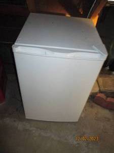 Near new in appearance White dorm-sized mini fridge