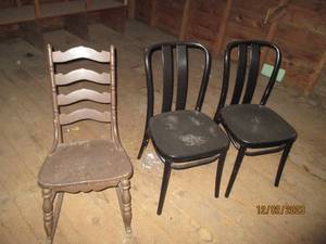 Antique wood rocking chair and a pair if Metal-looking wood chairs