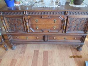 Vintage Wood Buffet Console with claw-foot style feet, intricate carved details and antique brass hardware.