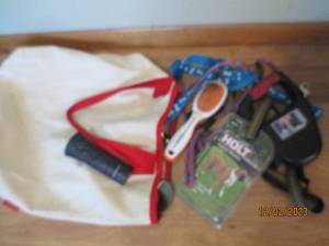 Reusable canvas shopping tote with a BarkBuddy, large new control harness and other dog supplies