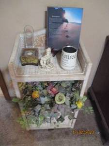 Off white Wicker Rattan night stand along with beautiful faux floral and other decor