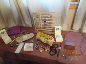 Variety of beautiful costume design jewely, earring tree, trinket box, watches and more
