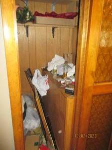 Content of the butlers pantry includes household maintenance supplies, misc decor and personal supplies