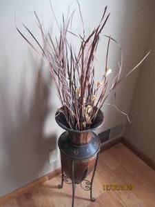 Decorative Metal frame flower urn with whispy dried accents. Piece without accents is approximately 27